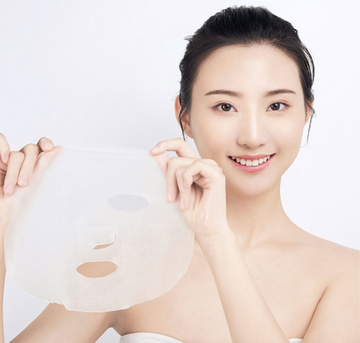 Coconut sheet mask applied for a refreshing at-home self care routine
